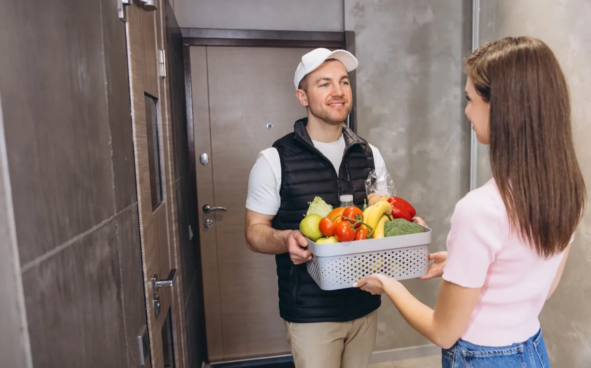 Grocery delivery handed to a customer