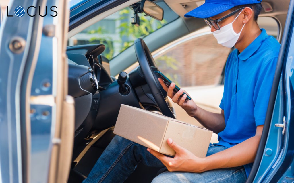 Fleet driver checking the delivery details on his smart phone using Locus route optimization software