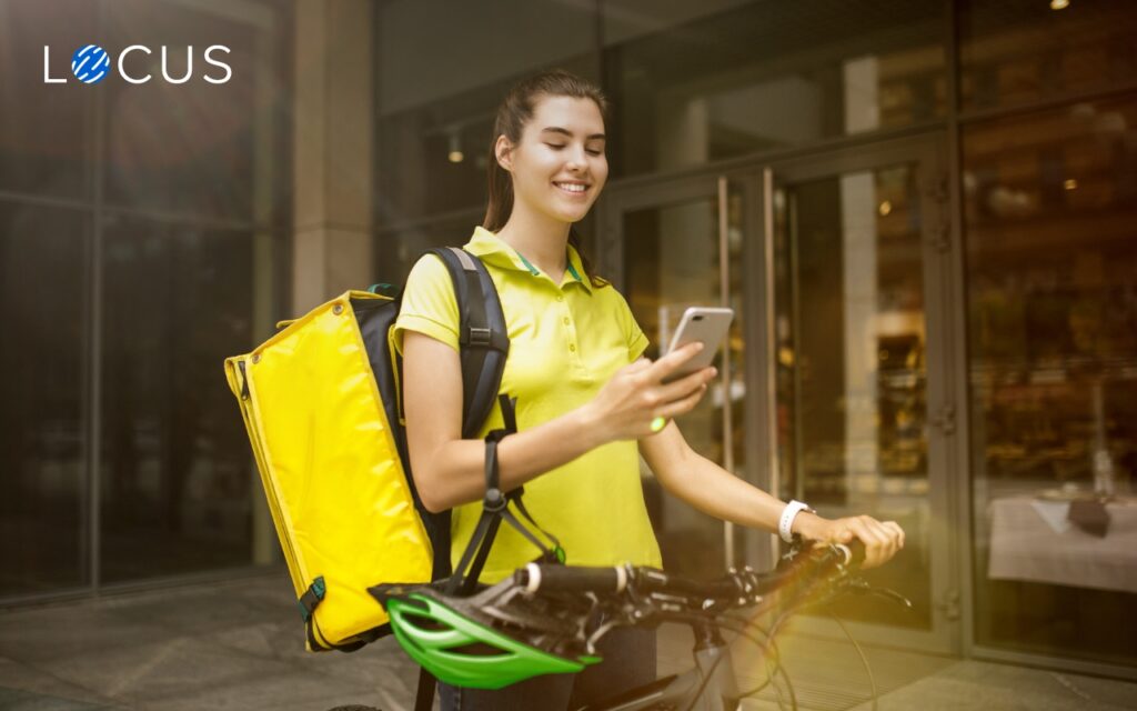 A field agent using delivery logistics software on her smartphone