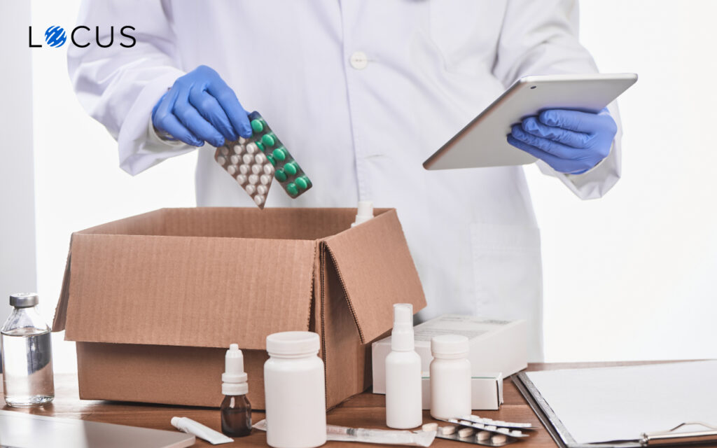 Pharmacist boxing with medicines with the help of Locus logistic software