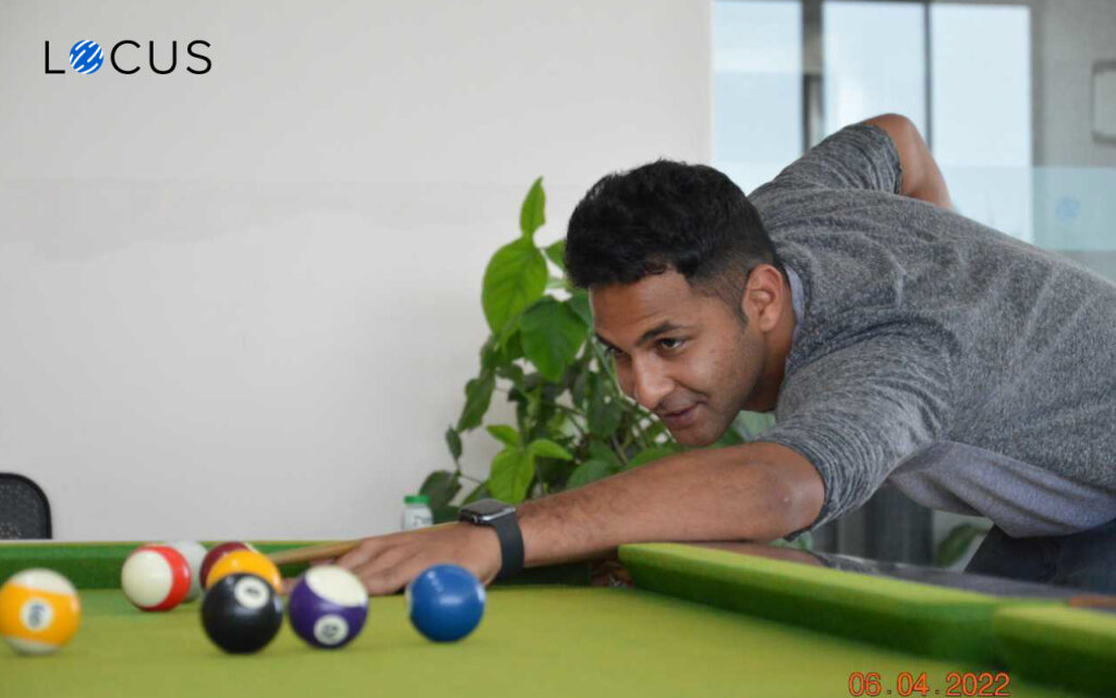 Playing snooker Locus employee playing snooker