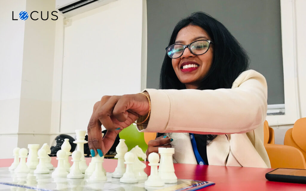 Chess Locus employee playing chess