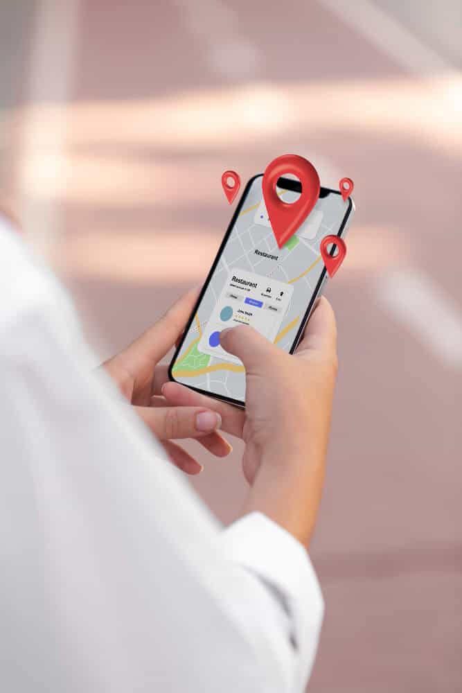 Person using a mobile app to track delivery locations on a map.