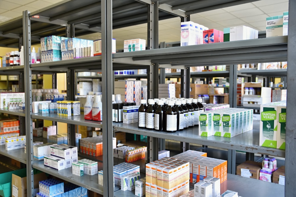 Shelves stocked with pharmaceutical products in a warehouse