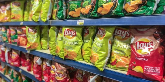 Departmental shelves stocked with Frito-Lay’s snack product - Lay’s in Direct Store Delivery